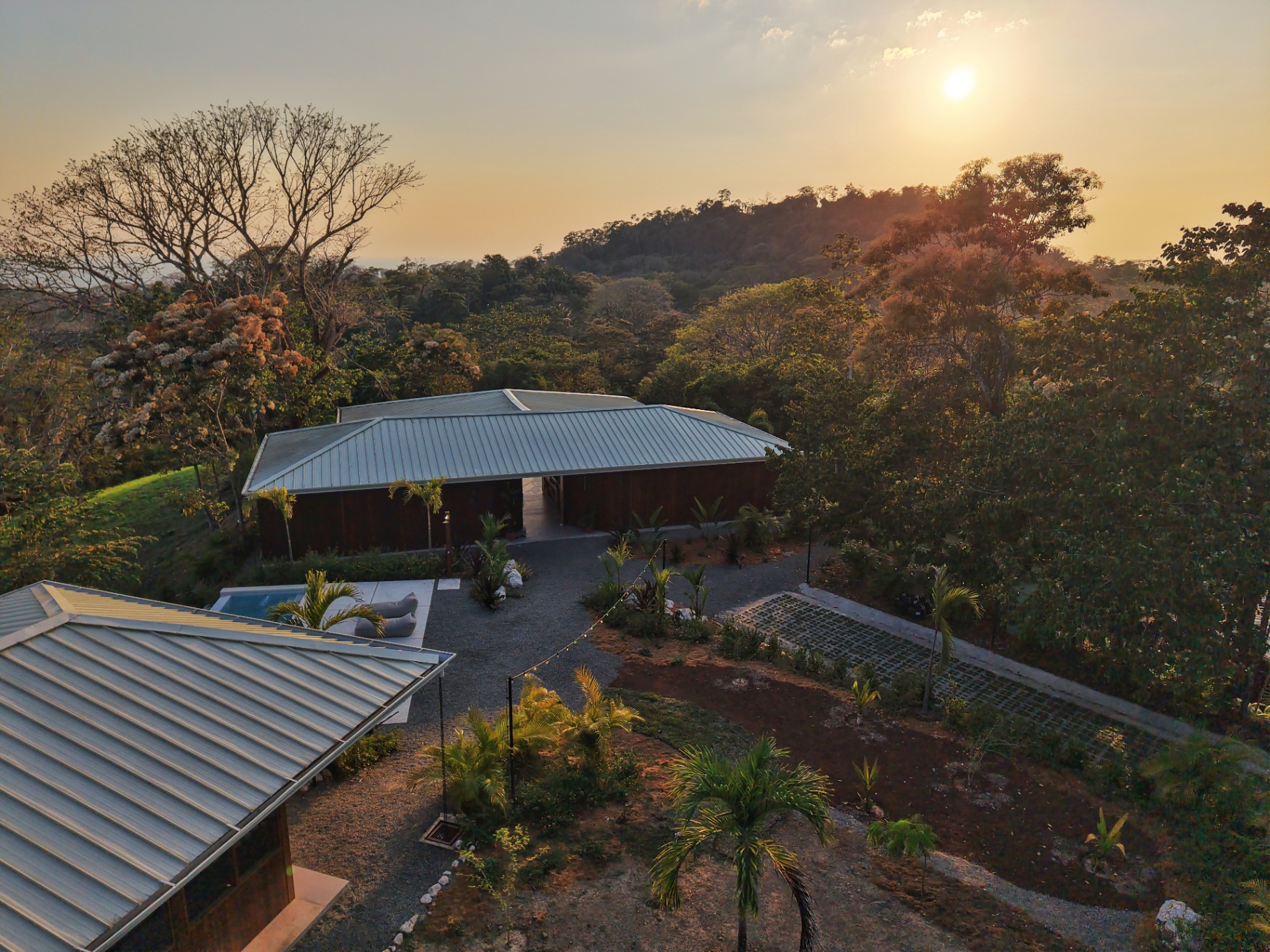 Villa Symphony at golden hour, set within the jungle above Mal País