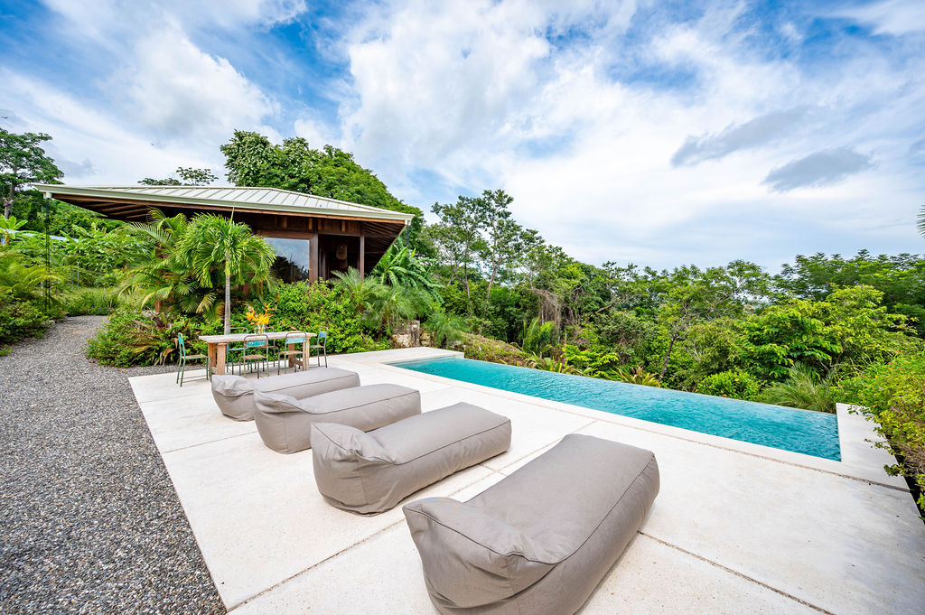 Infinity pool looking out to the horizon with the timber pavilion alongside
