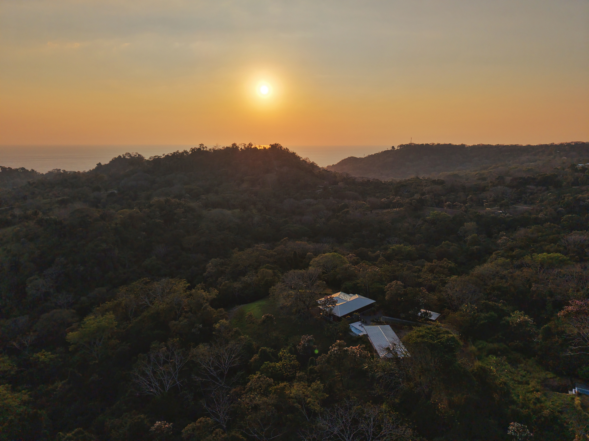 Villa Symphony at sunset, ridgeline and Pacific horizon beyond
